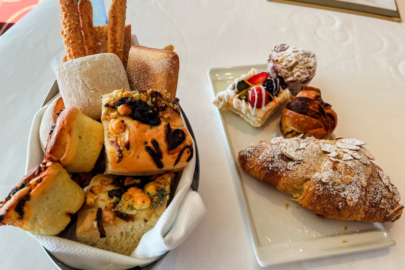 Bread basket and plate of breakfast pastries at Disney Cruise Line's Palo