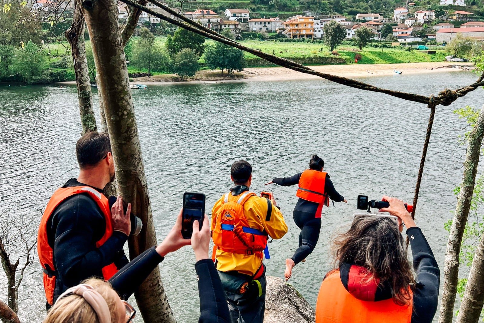 A passenger dives into the Douro River from an outcropping at Love Island