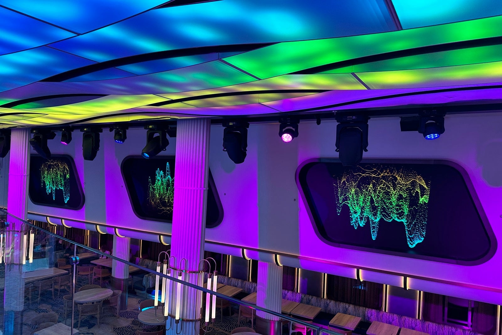 A row of window-shaped LED screens with colored lights