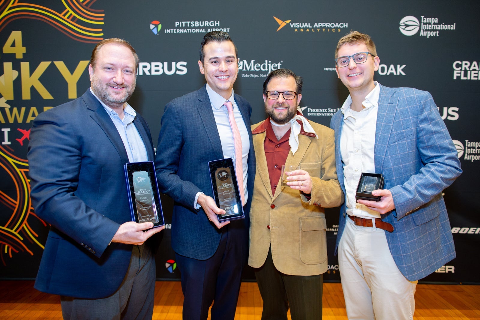 United's route-planning team poses with Brett Snyder to show off the airline's 2024 Cranky Network Award winners. 