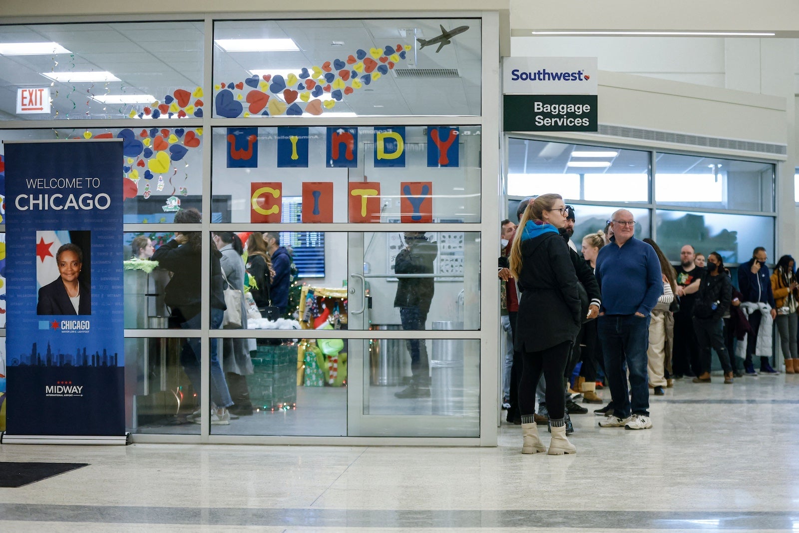 Travelers at Southwest baggage claim at Midway Airport