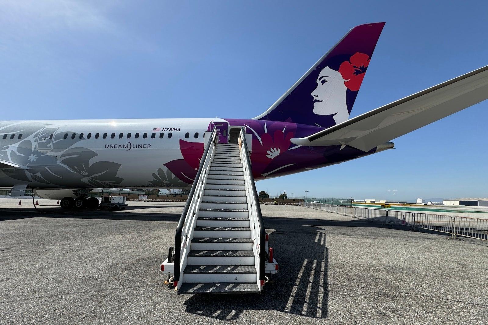 stairs leading up to hawaiian airlines plane