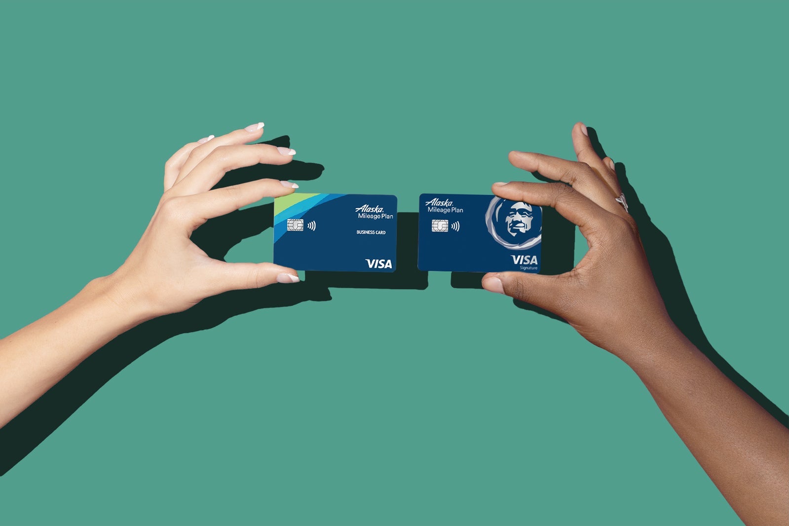 Comparison of hands holding cards