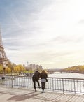 Tourist couple looking at The Eiffel Tower in Paris, France