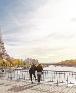 Tourist couple looking at The Eiffel Tower in Paris, France