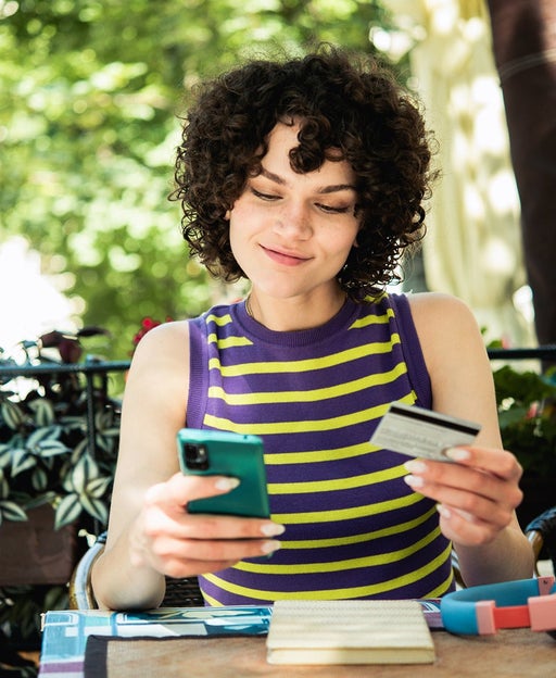 Portrait of a beautiful girl banking online