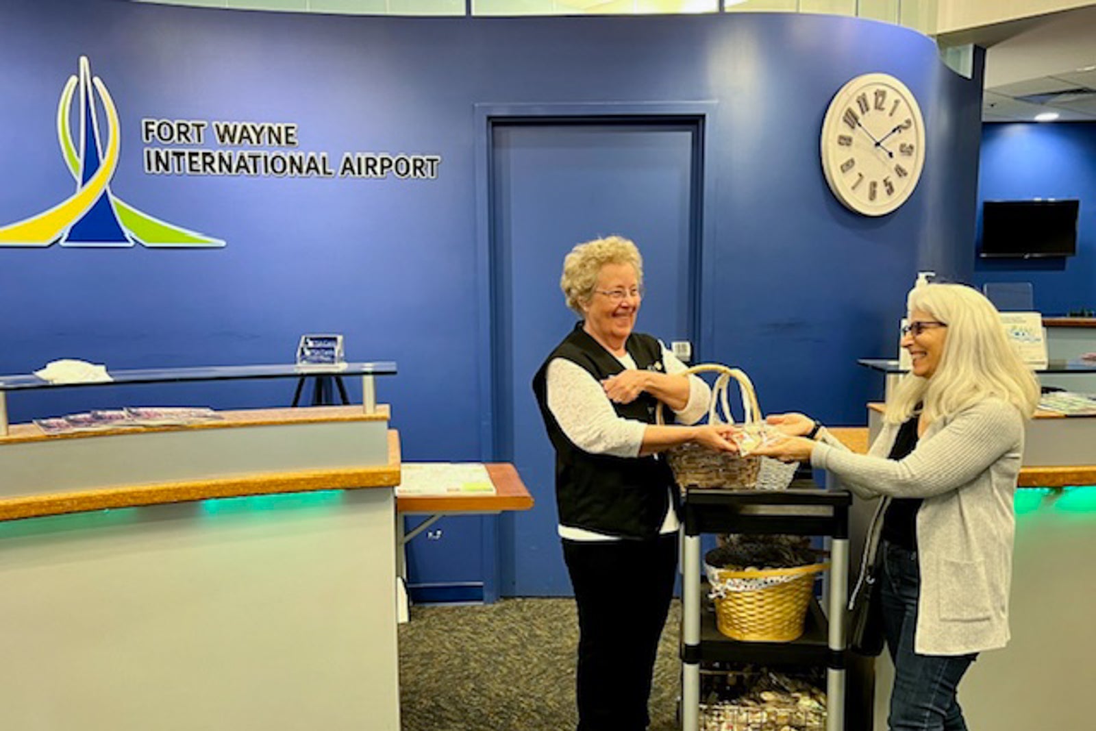 woman handing cookies