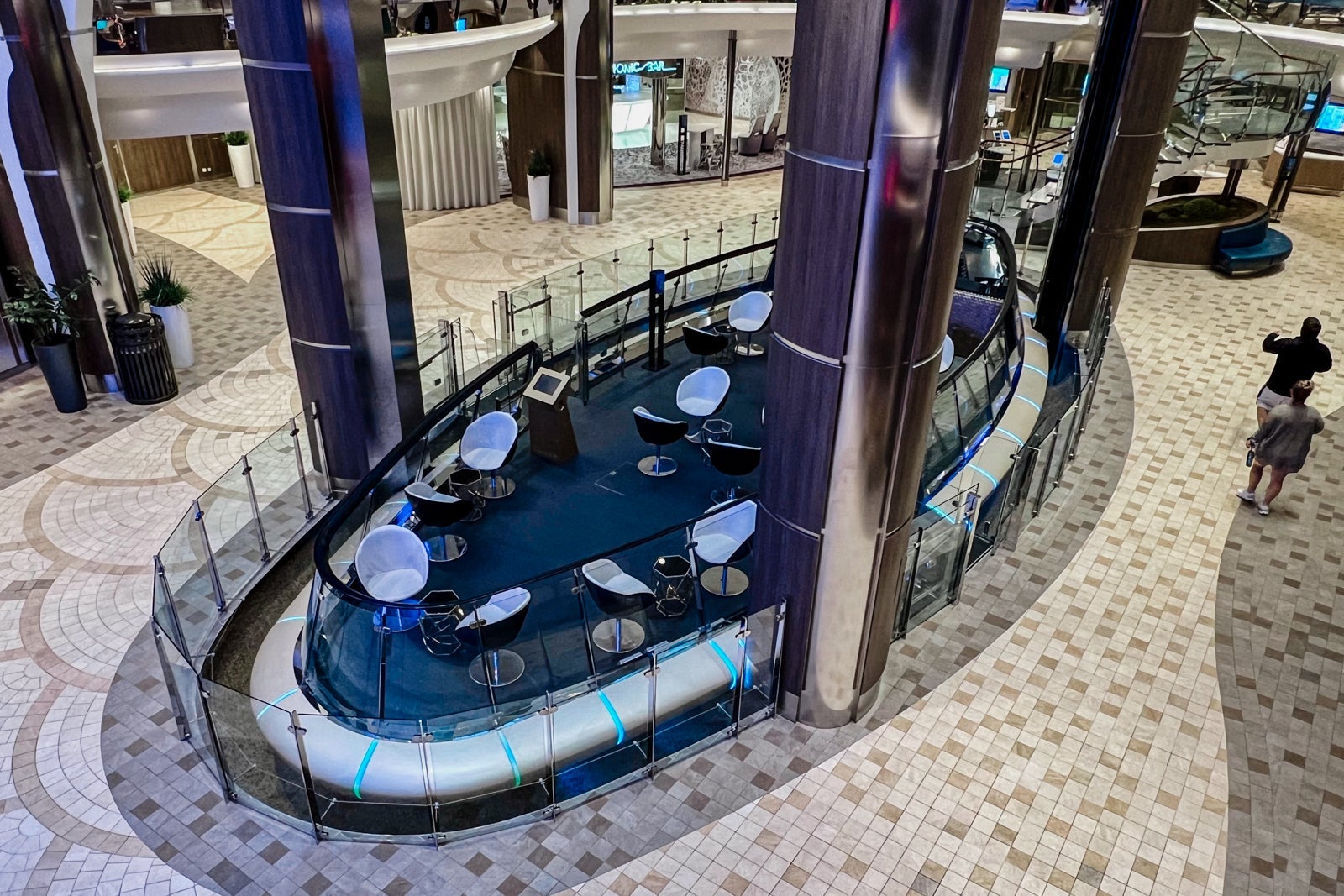 The Rising Tide bar moves between the Royal Promenade on Deck 5 and Central Park on Deck 8.