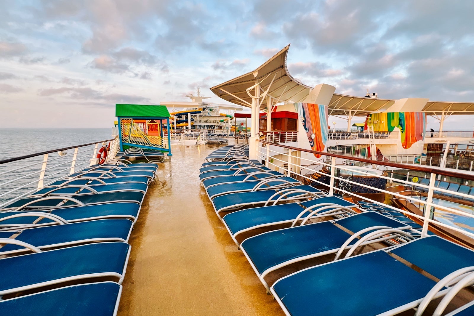 Lounge chairs atop Symphony of the Seas
