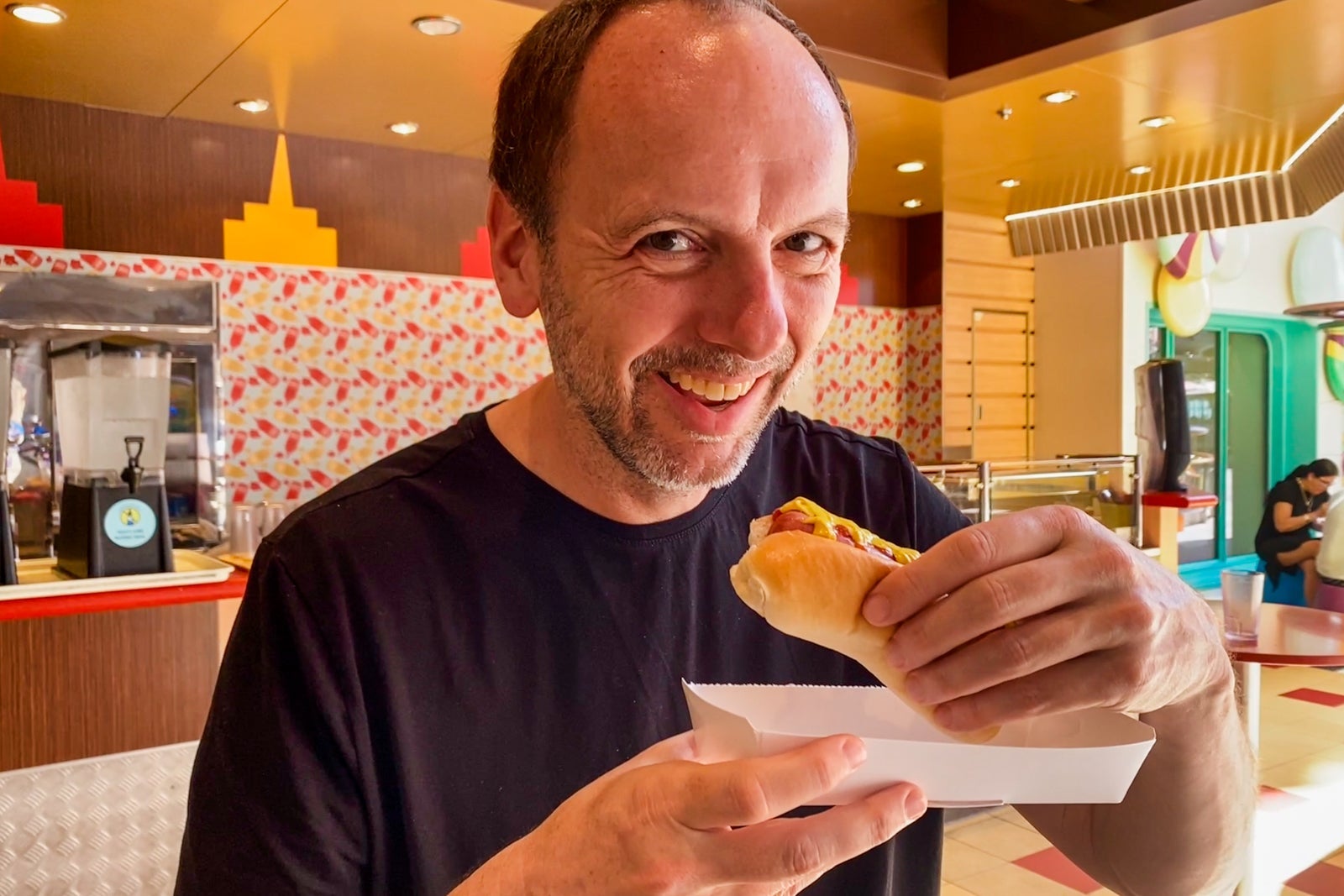 TPG's Gene Sloan noshes on a hot dog at Boardwalk Dog House