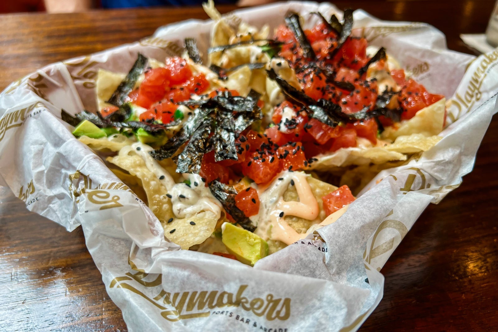A tuna-topped nachos dish at Playmakers