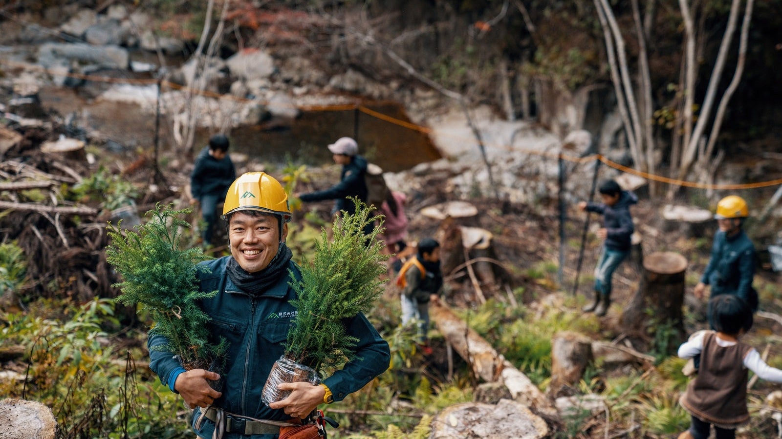 Forester with seedlings at a volunteer tree planting and reforestation event