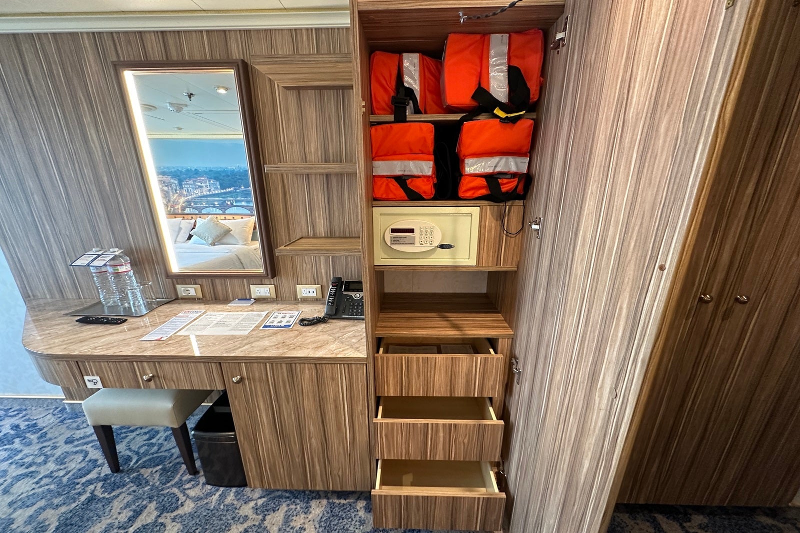 A vanity and closet in a cabin aboard the Carnival Firenze