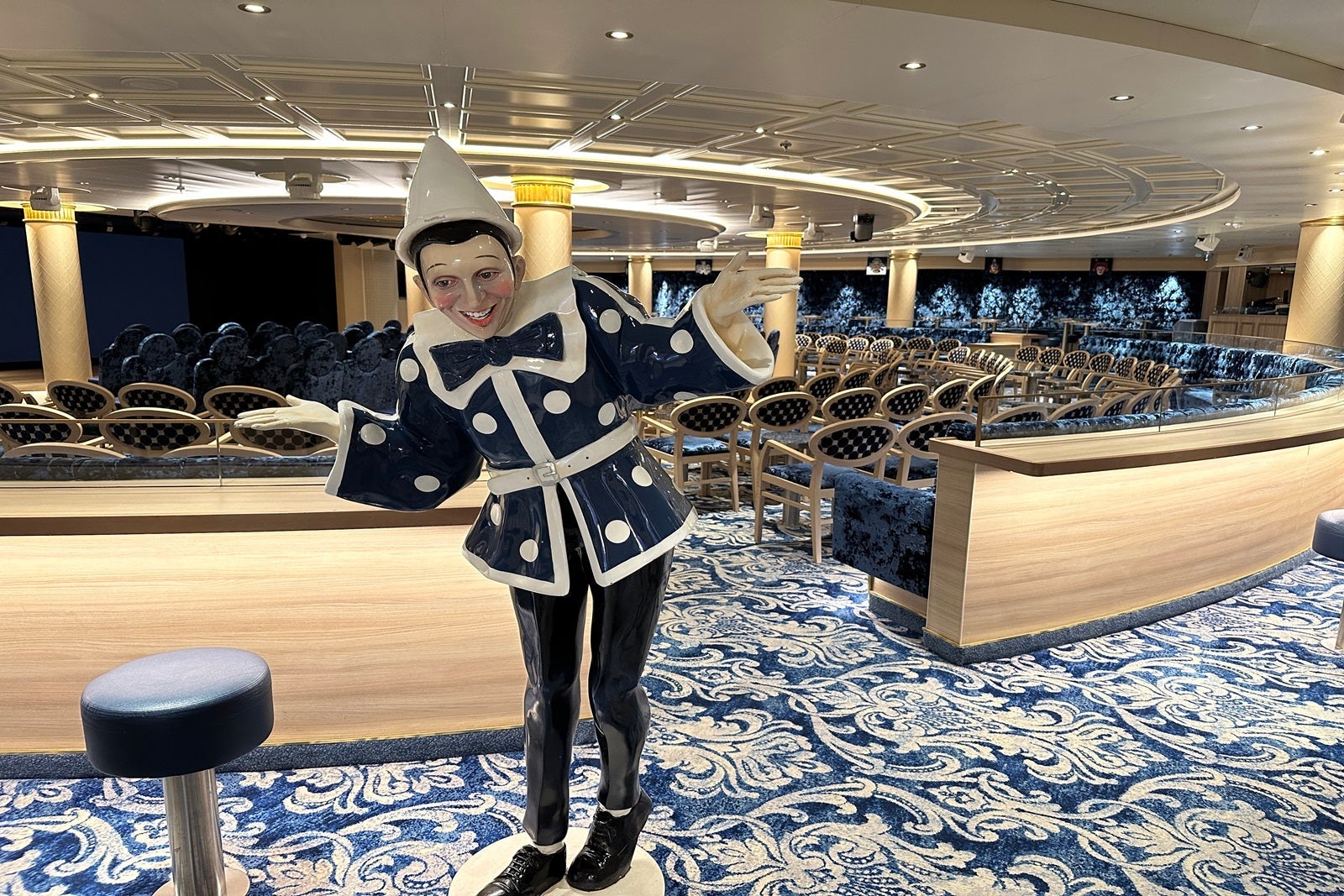 A clown at the entrance to cruise ship lounge