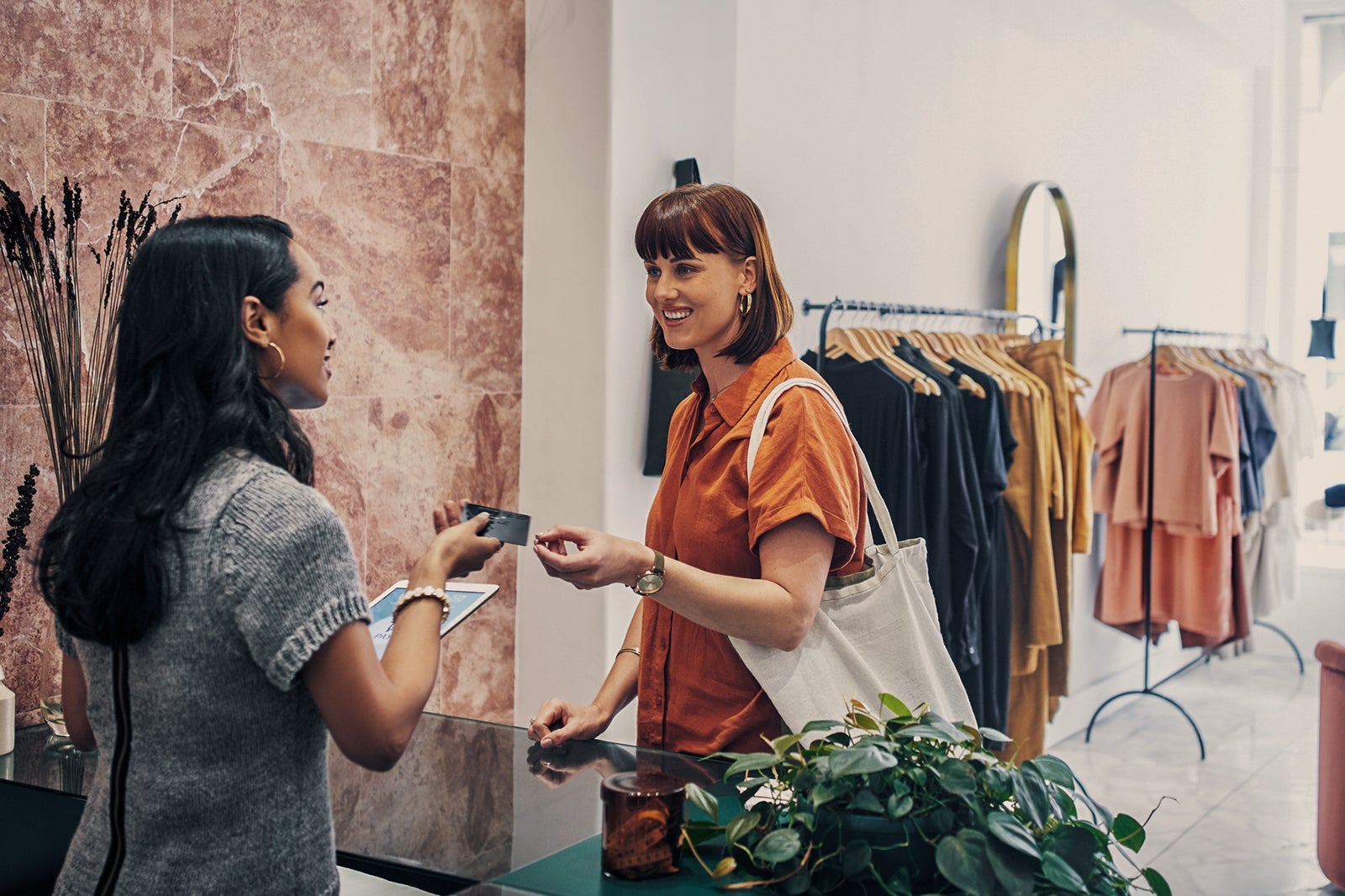 A person using contactless payment to pay for a purchase