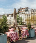 Cafe on the bank of the Seine river on a sunny day, Paris, France