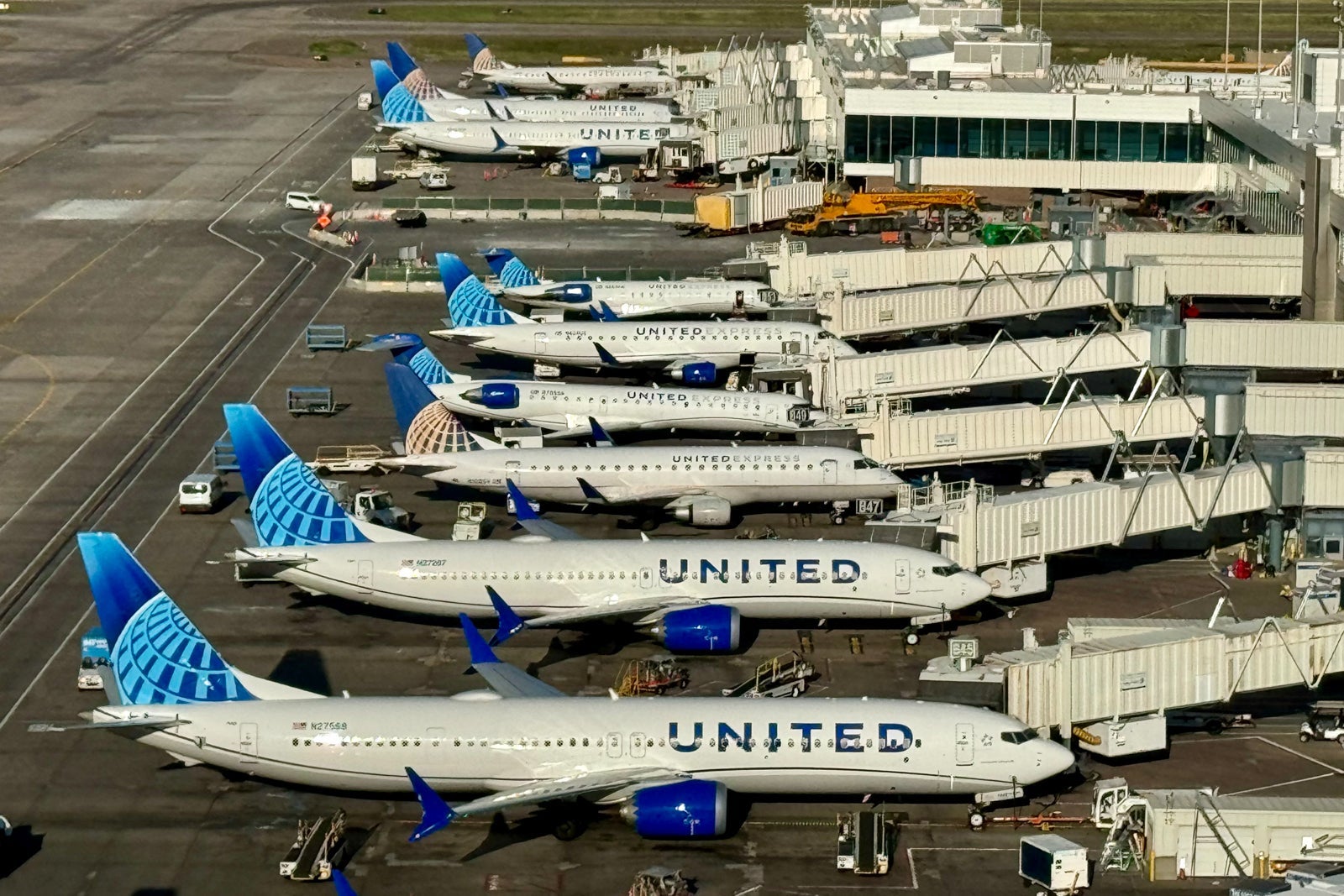 aerial view of several United planes at gates
