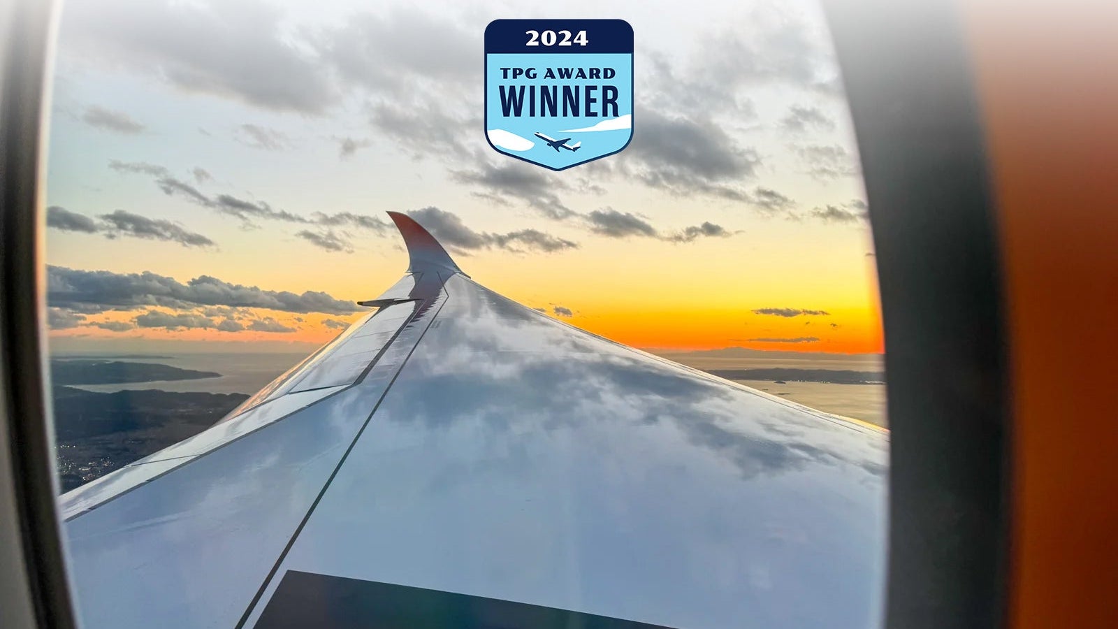 20240125_JAL-A350-1000-Inaugural_ERosen-wing-reflecting-sky
