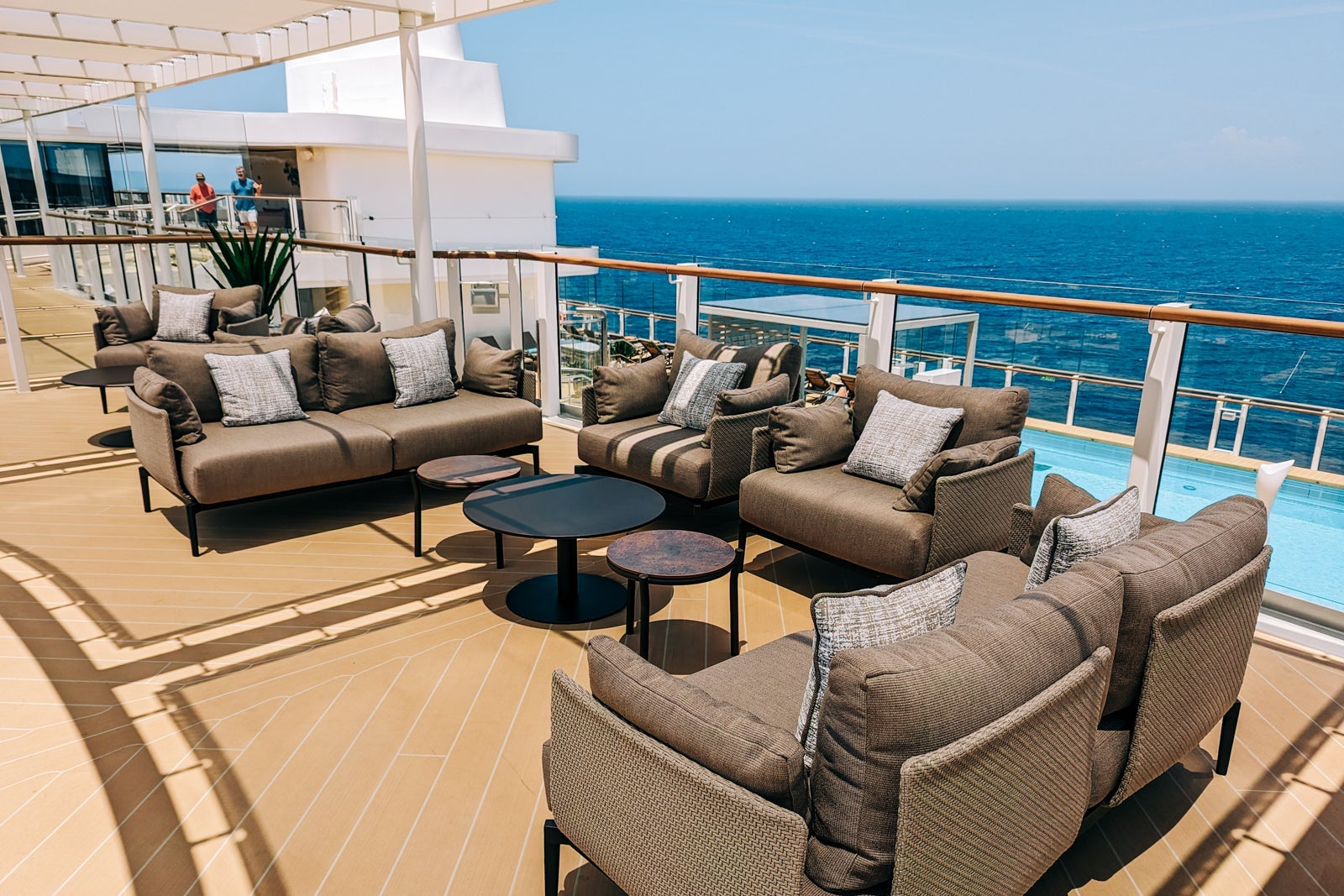 Top deck seating area of cruise ship in the ocean