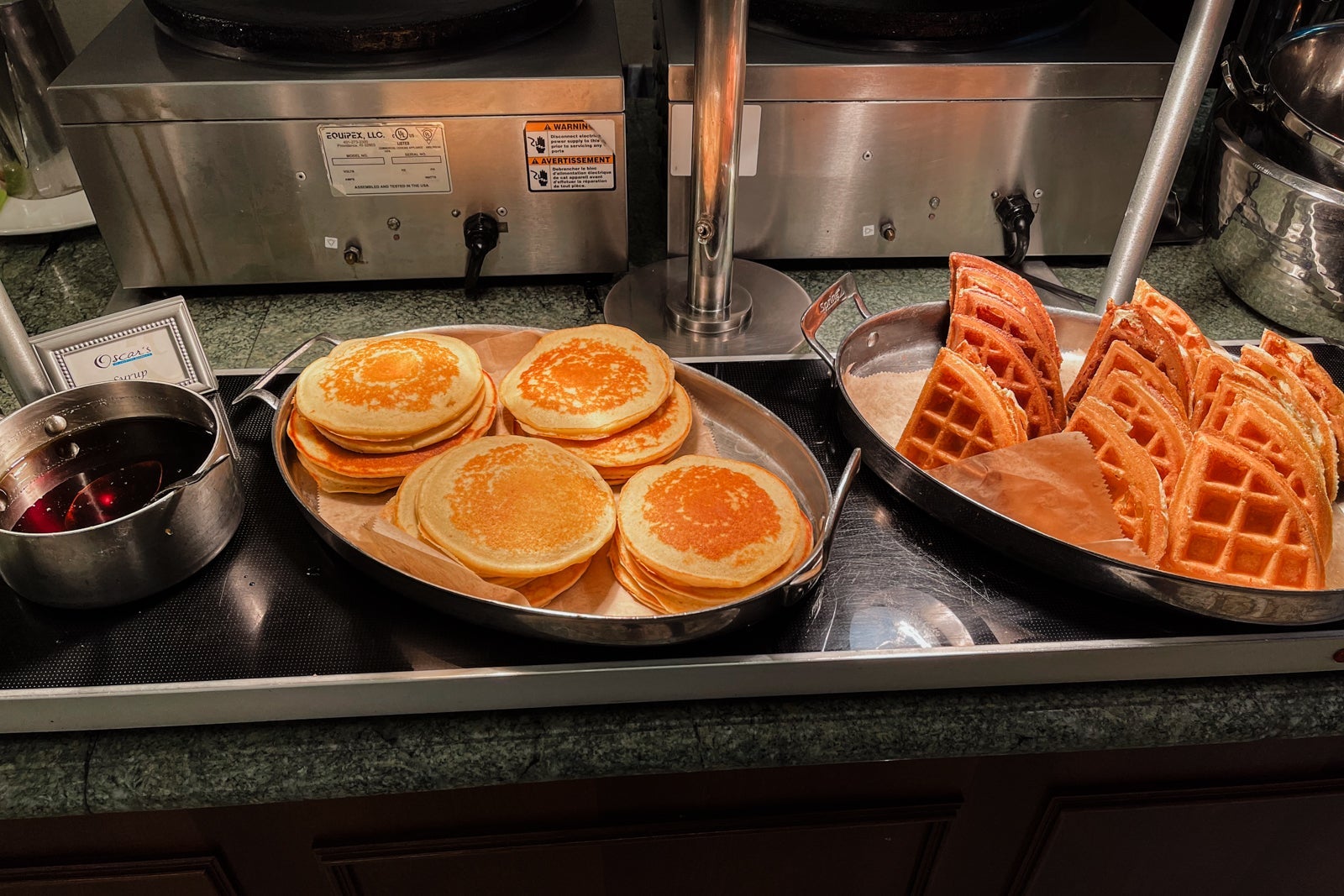 Pancakes and waffles on the breakfast buffet at Oscar's Waldorf Astoria Orlando
