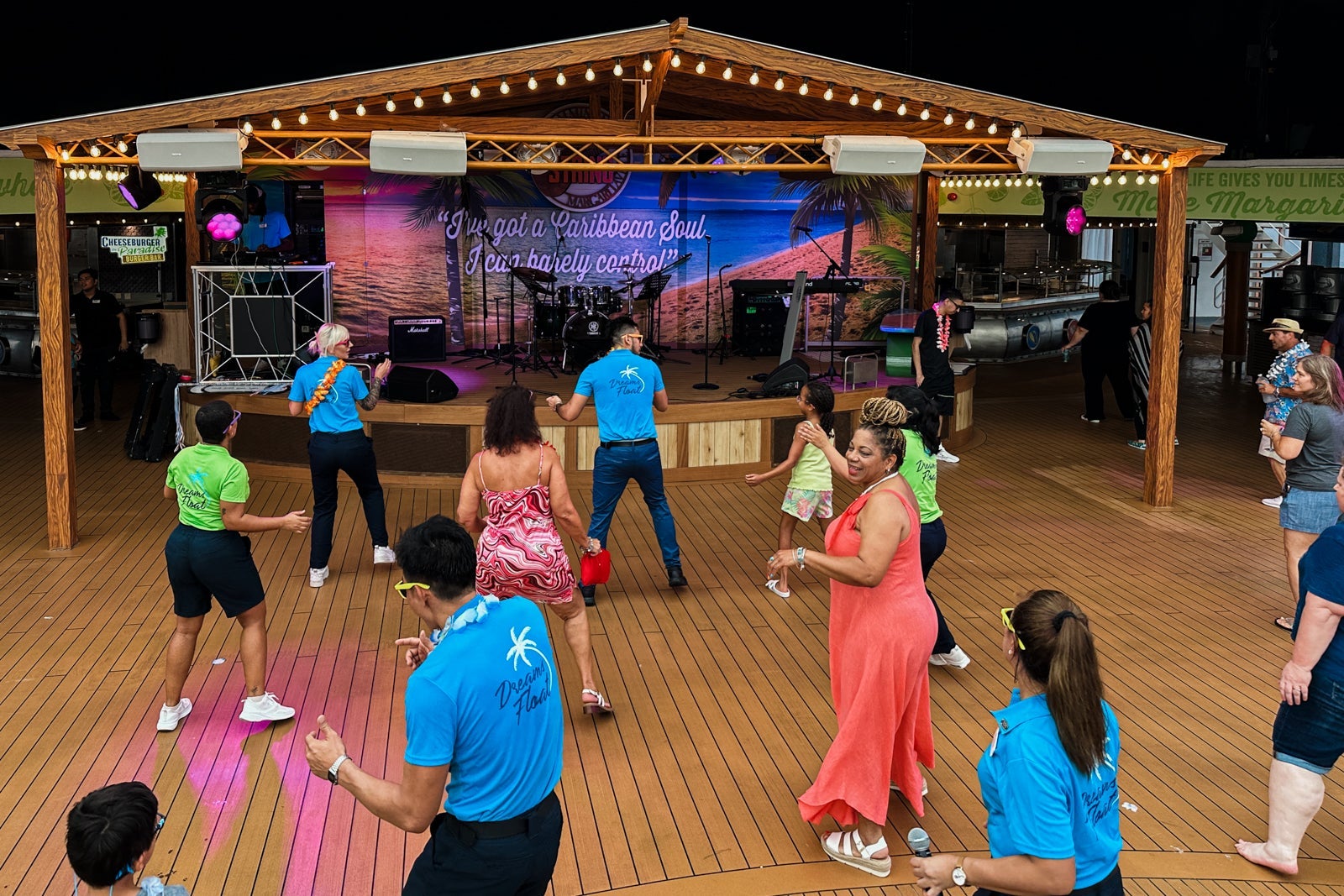 Cruise ship passengers dancing on the pool deck
