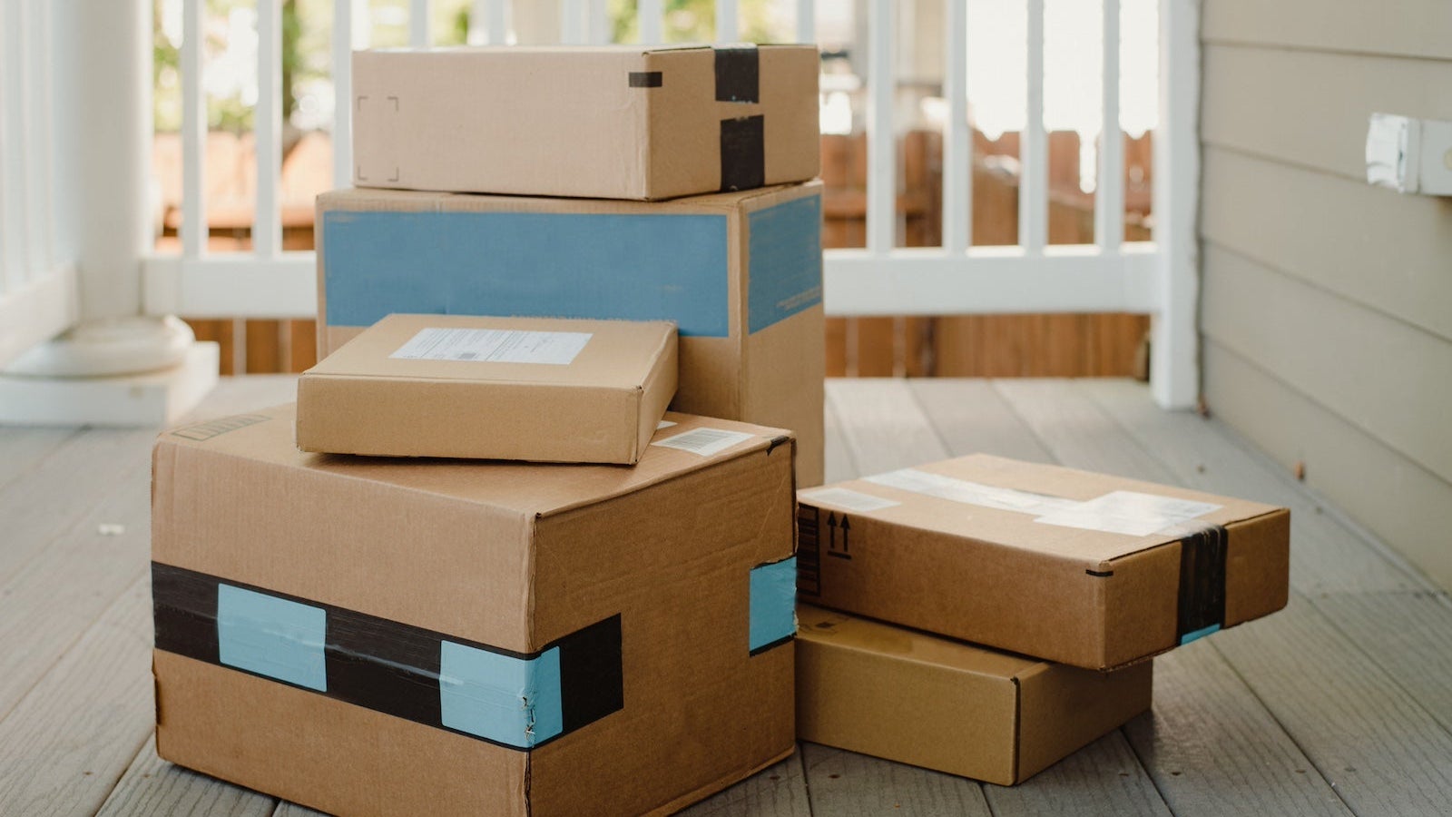 Stack of packages on front porch after mail delivery