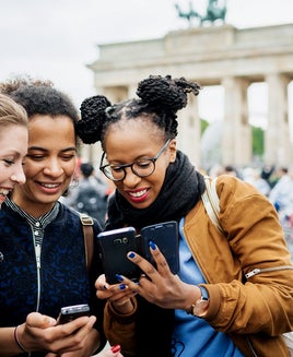 Friends looking at a phone