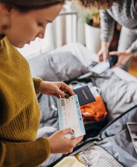 Two women packing for a trip.