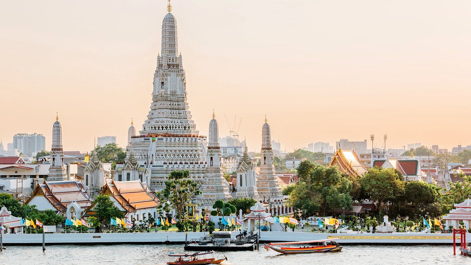 Wat Arun Buddhist temple and Chao Phraya river on a sunny day, Bangkok, Thailand