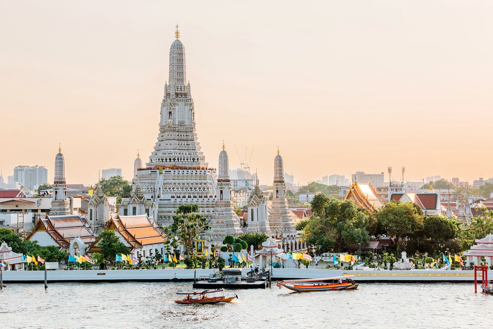 Wat Arun Buddhist temple and Chao Phraya river on a sunny day, Bangkok, Thailand