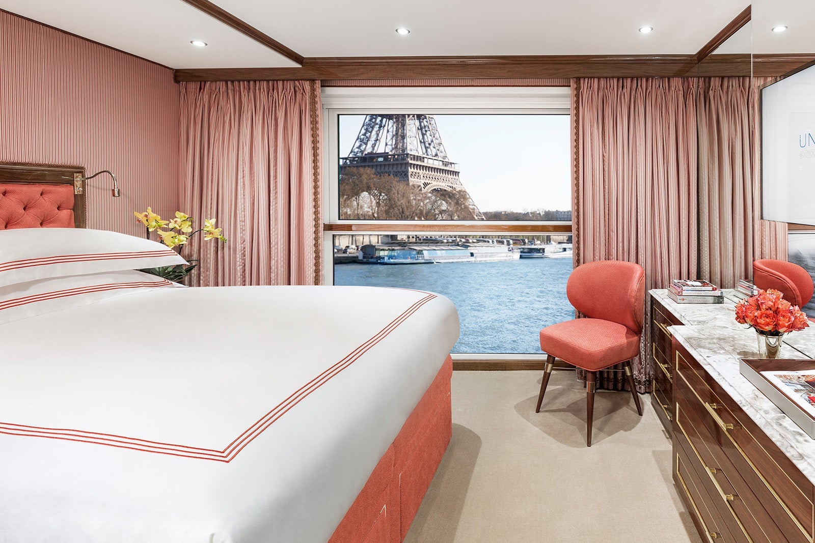 Bedroom of river cruise ship looking out at Eiffel Tower