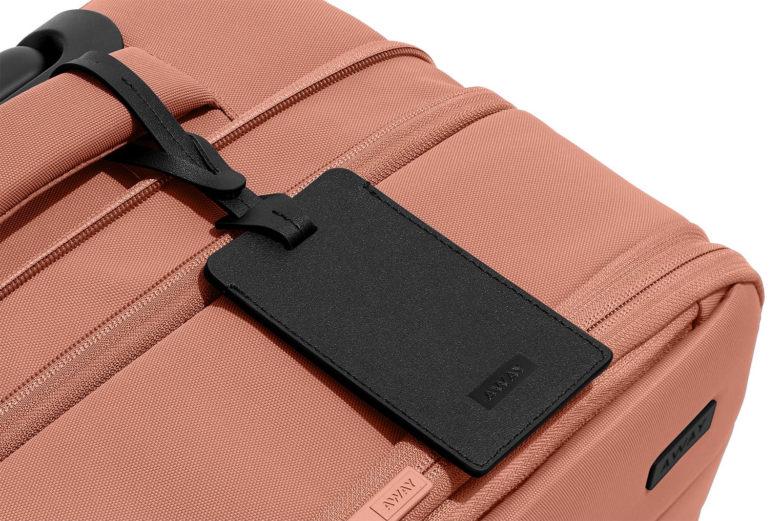 A tag on an softsided away suitcase