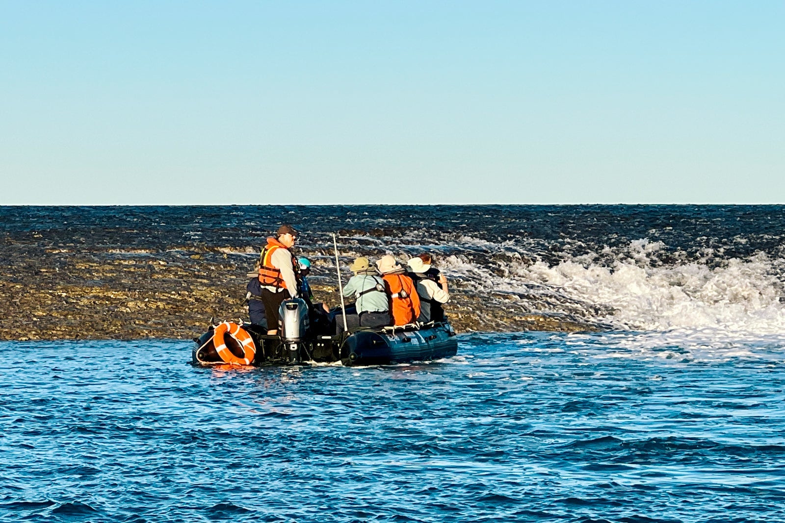 Seabourn Pursuit passengers view water rushing off Montgomery Reef