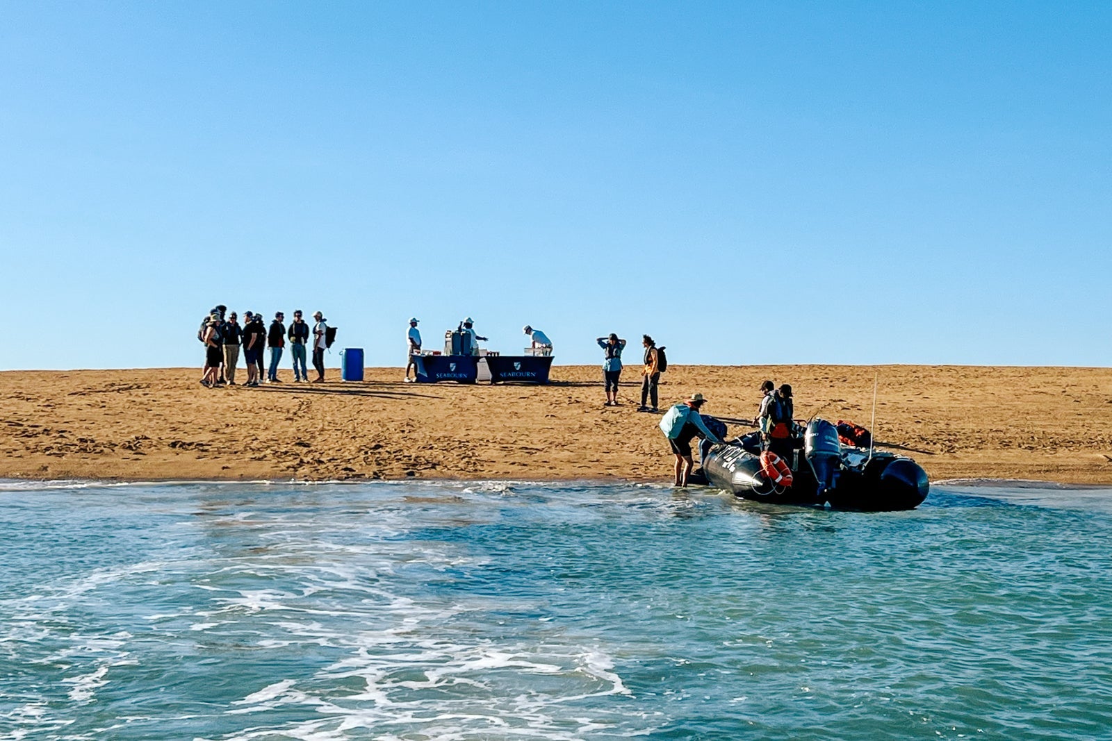 Landing by Zodiac at a sandbar near Montgomery Reef for drinks