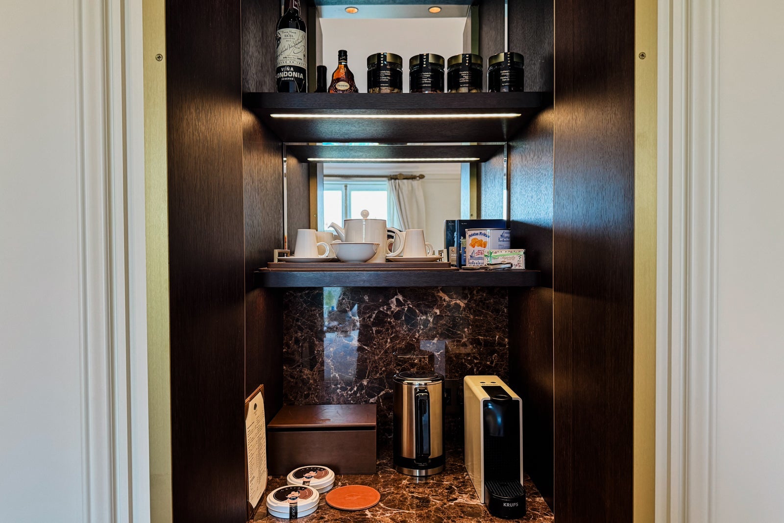 The hotel room's coffee and wet bar area