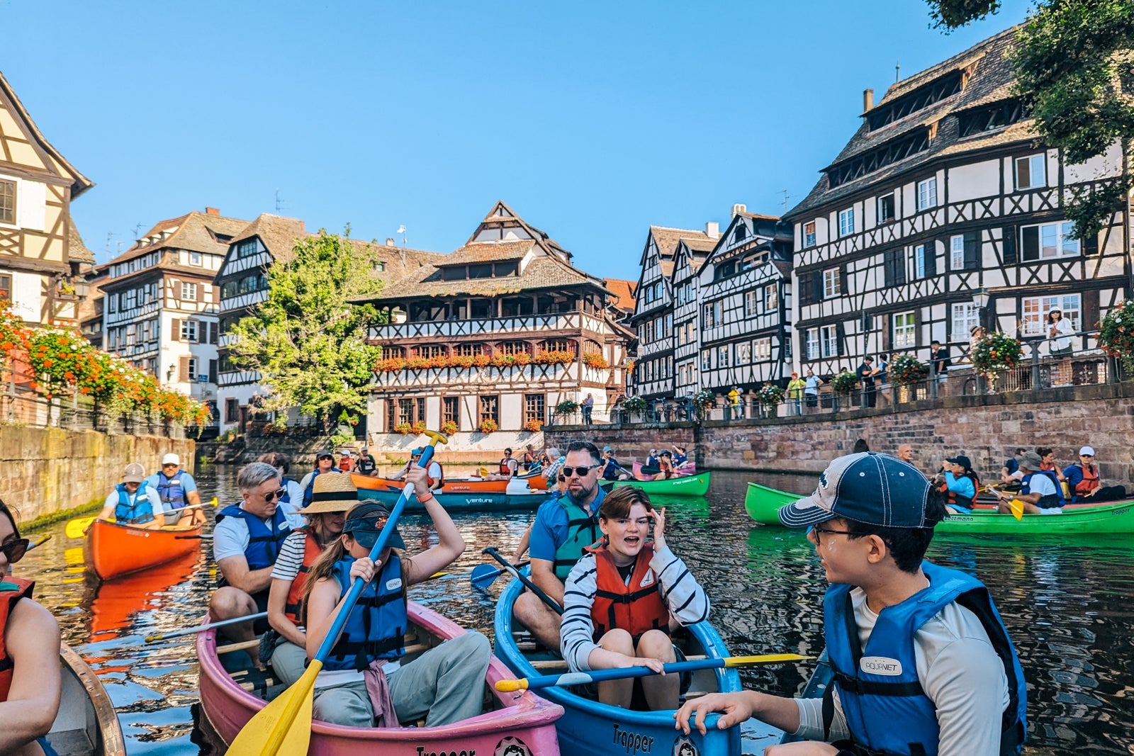 Family canoes during river cruise excursion