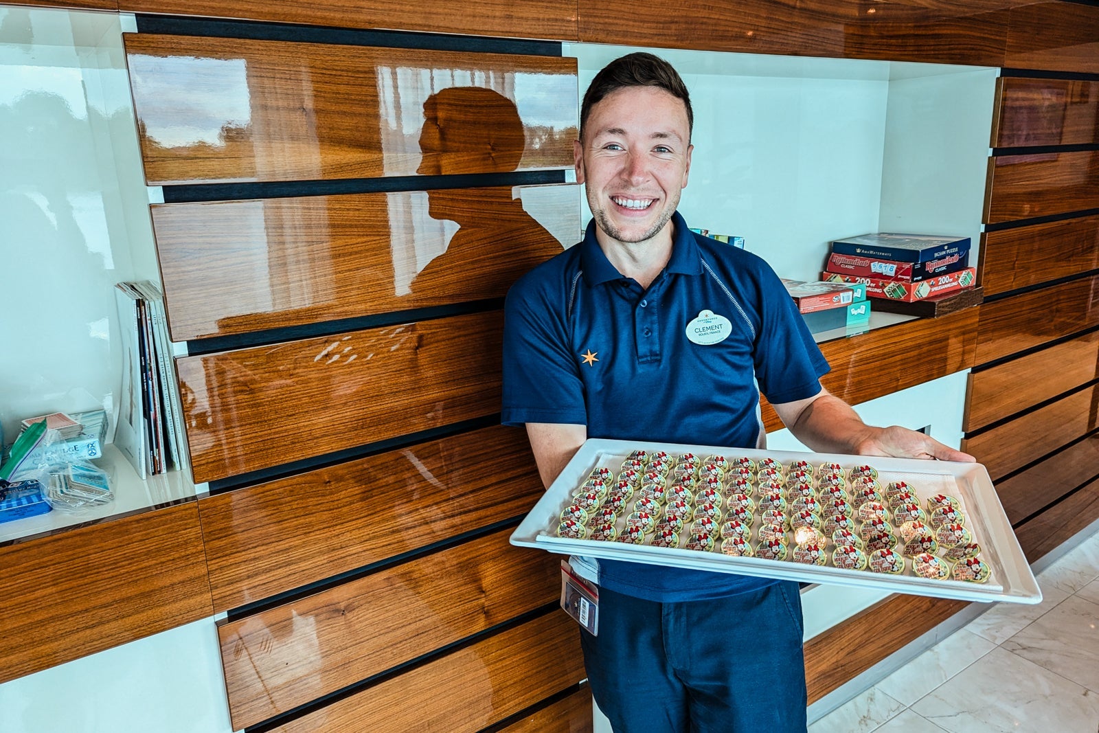 Man holding tray of pins