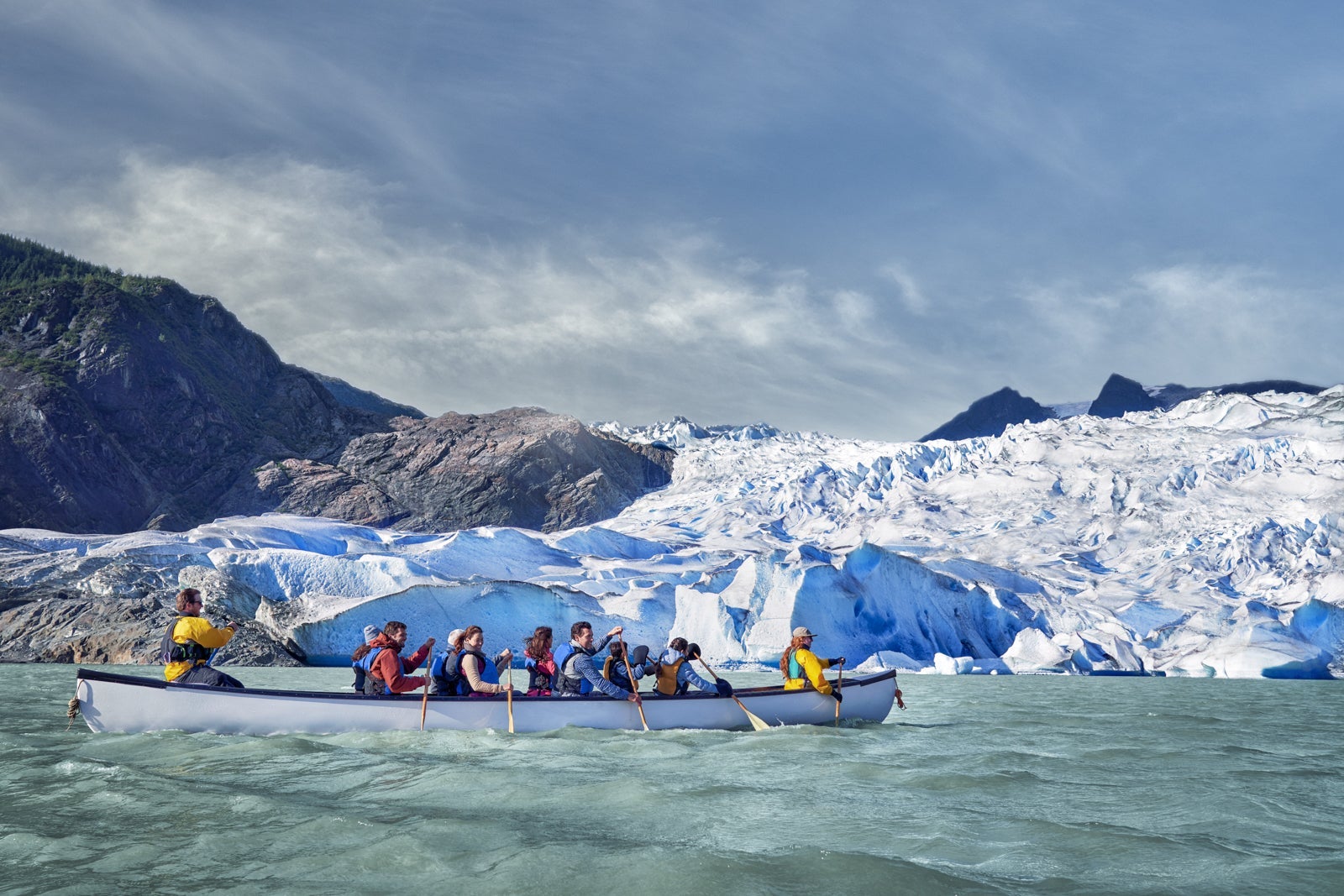 Canoe group in front of Alaskan glacier