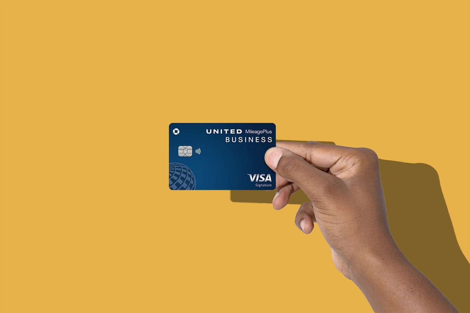 Hands holding credit cards