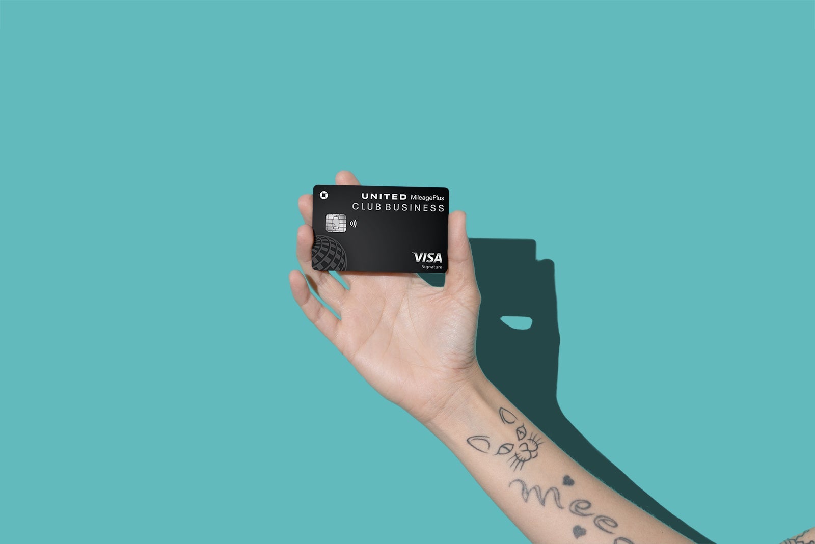 Hands holding credit cards