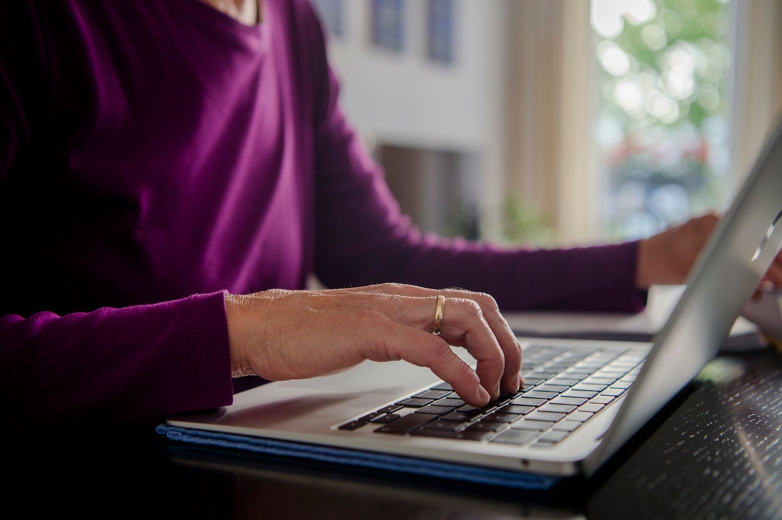 Woman typing on a computer