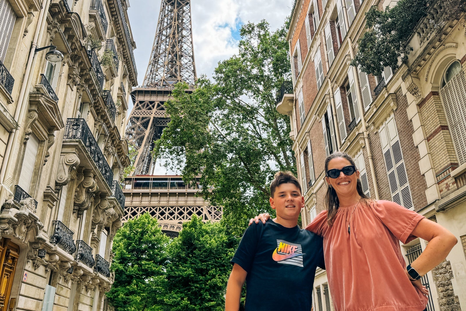 Writer Tarah Chieffi and son posing in front of Eiffel Tower