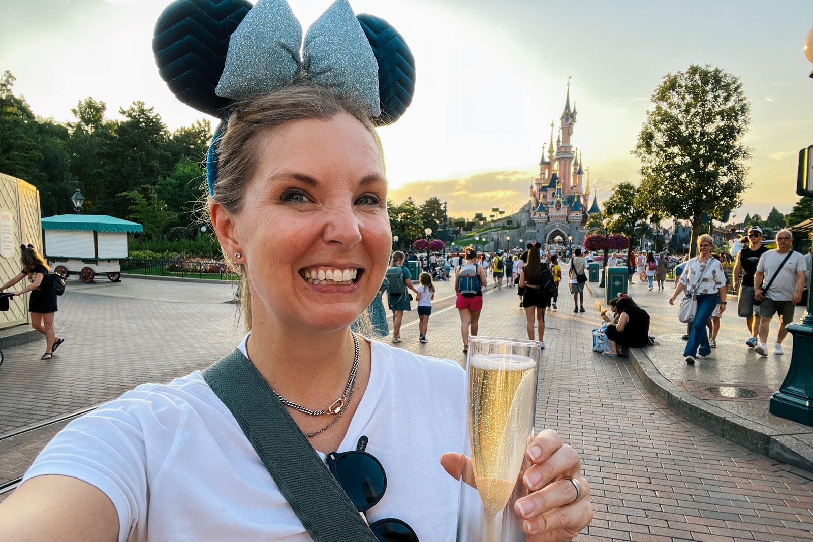 Woman holding Champagne at Disneyland Paris