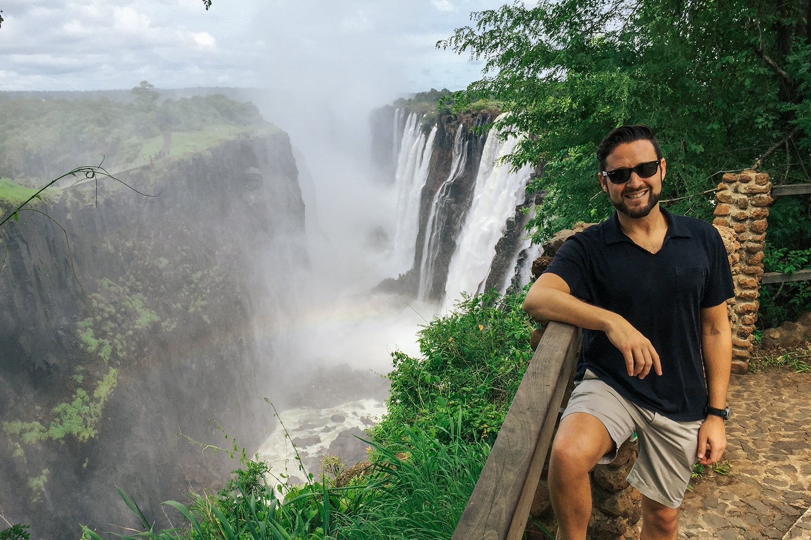 Eric Rosen posing in front of Victoria Falls