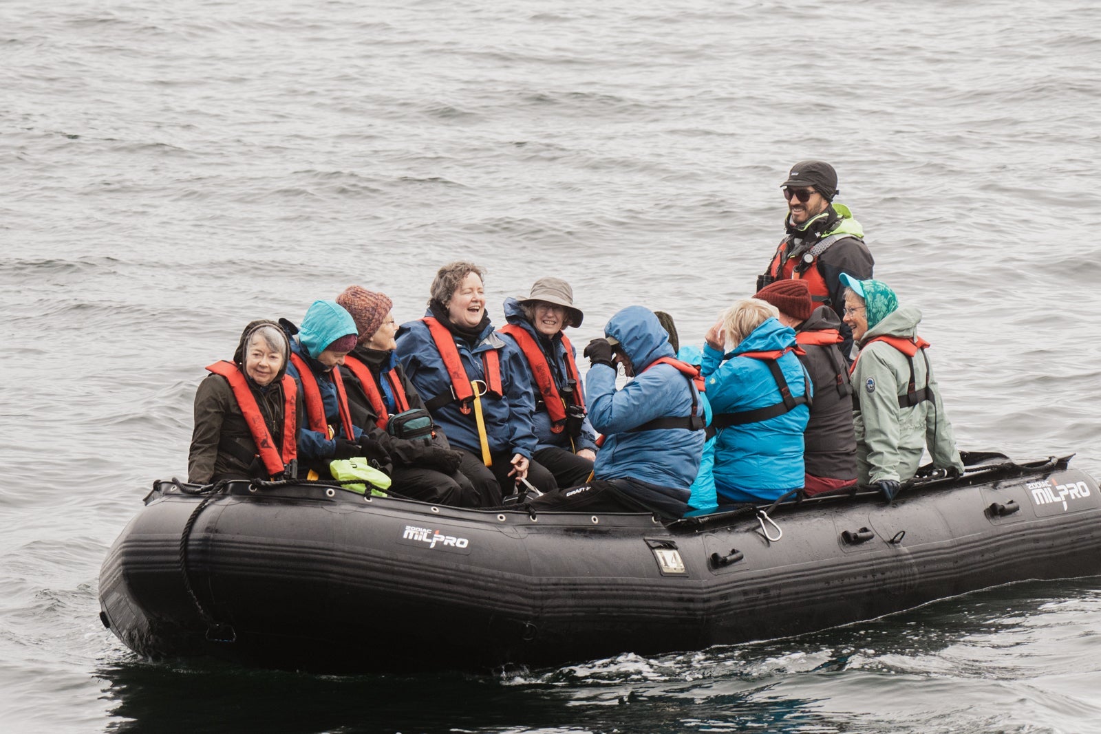 Travelers in a Zodiac boat in Scotland