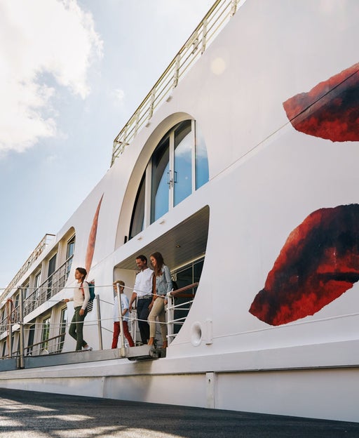 Family walking out of river cruise ship