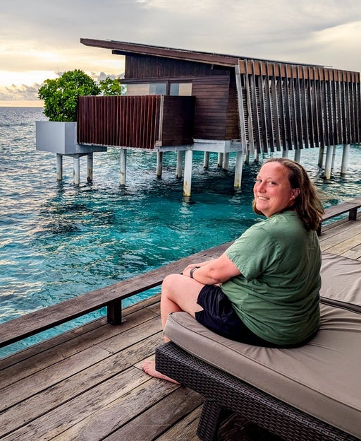 Park Hyatt Maldives with Katie Genter on the deck of an overwater villa