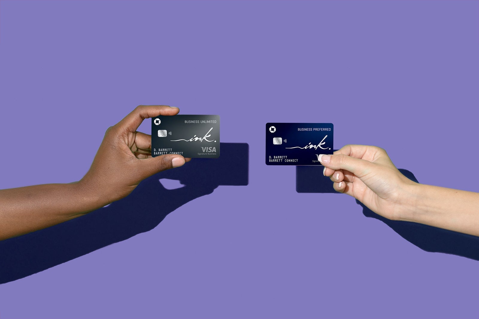 Hands holding credit cards