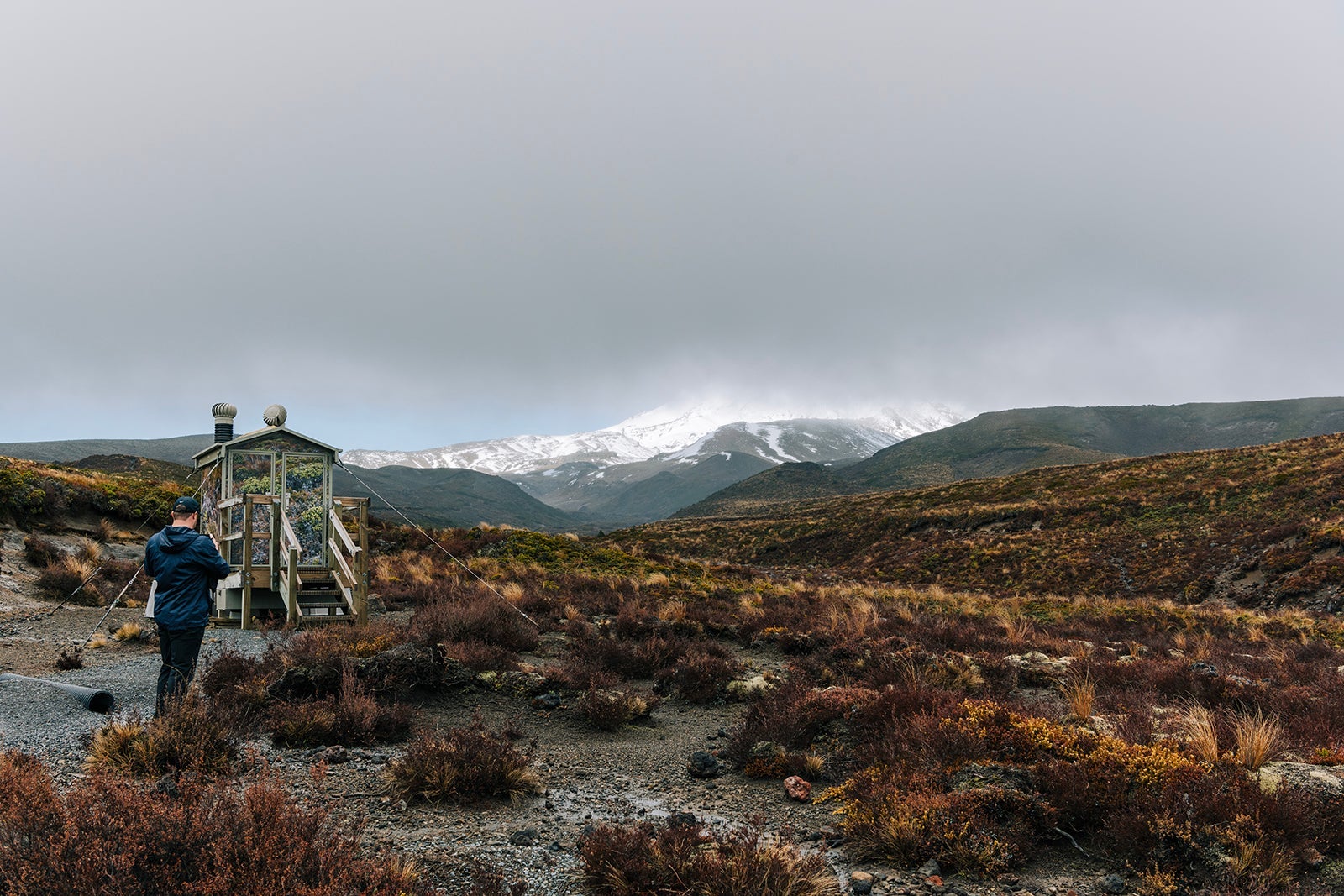 Mount Ngauruhoe covered in fog. Seen from Taranaki Falls Lower Track Hike in Tongariro National Park, New Zealand.