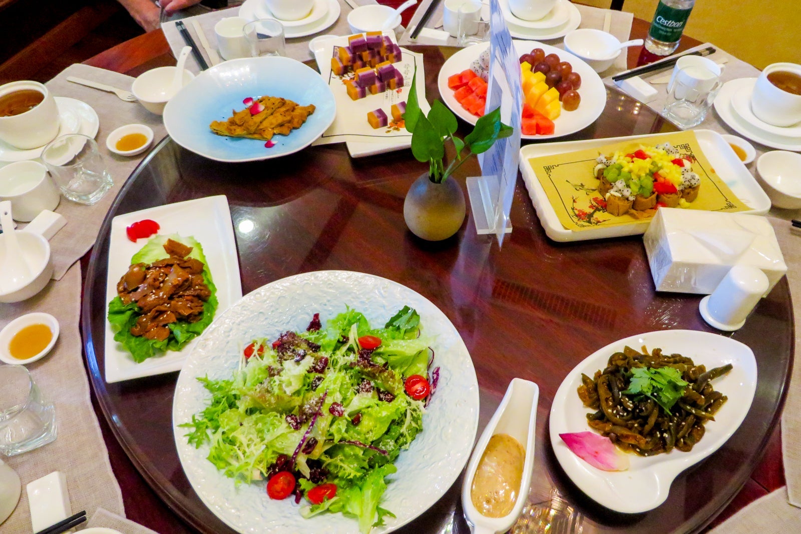 A Chinese-style lunch of sharing plates on a large lazy susan
